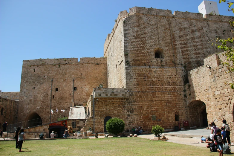 a castle like building that has a stone clock tower