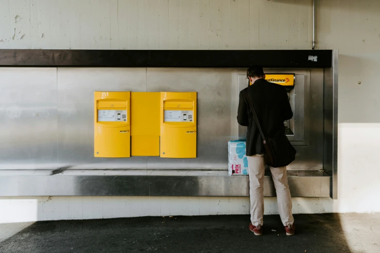 a person with luggage waiting at an airport