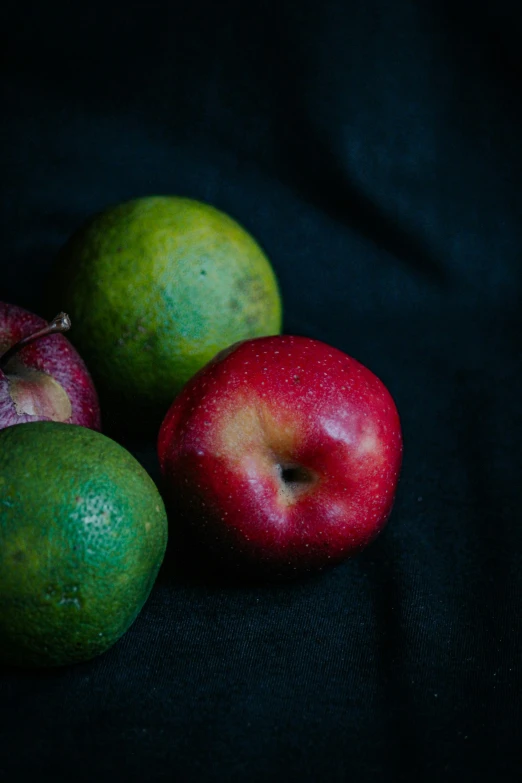 a couple of apples that are sitting on a table