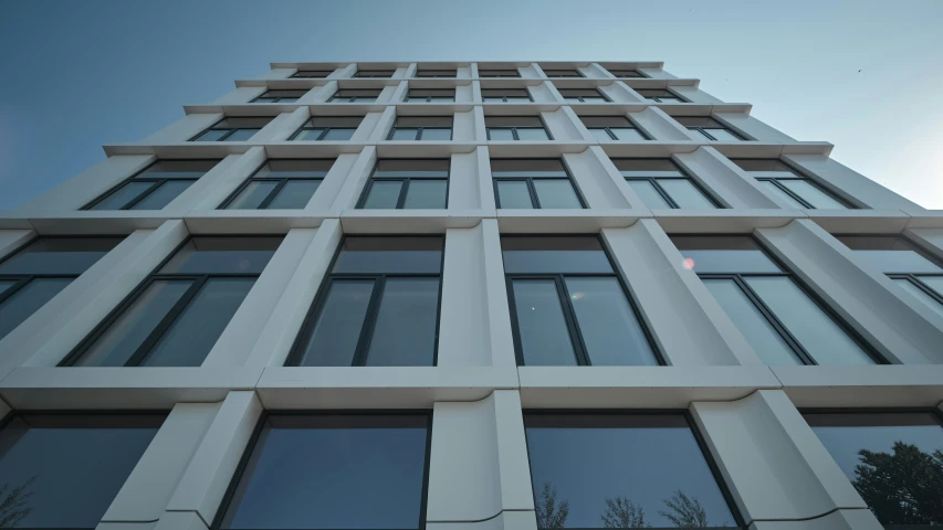 looking up at the top of a tall building