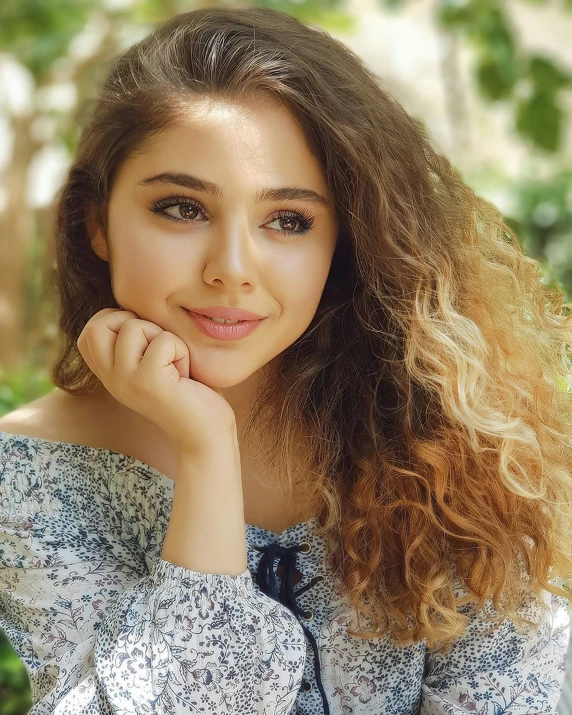 the young woman is sitting on the bench