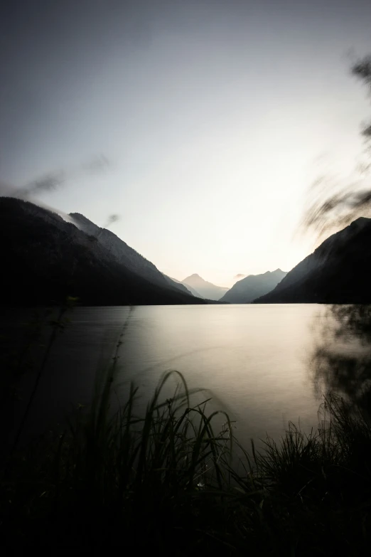 a lake with mountains in the background