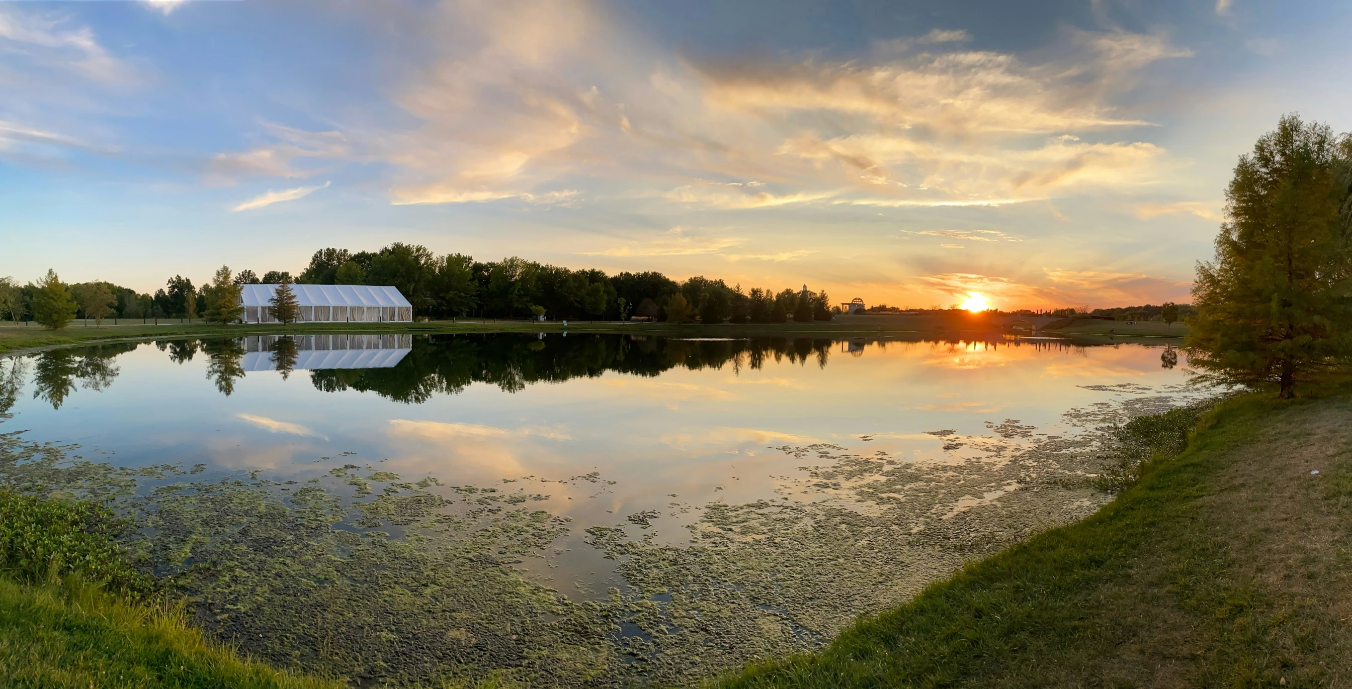 a view of a lake in a beautiful sunset