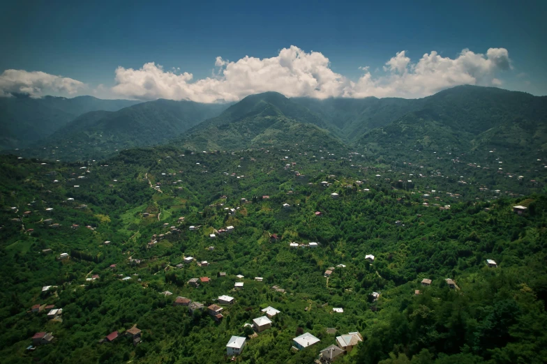 green, lush mountains and town nestled in the distance