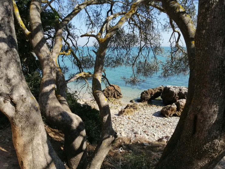 the view from the coast of a secluded beach