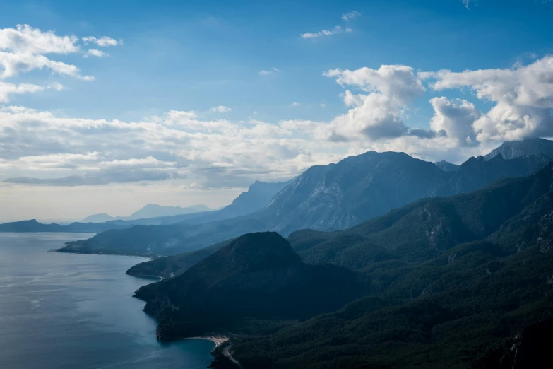 a river with mountains in the distance