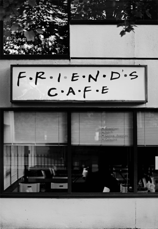 a coffee shop sign reading friends cafe