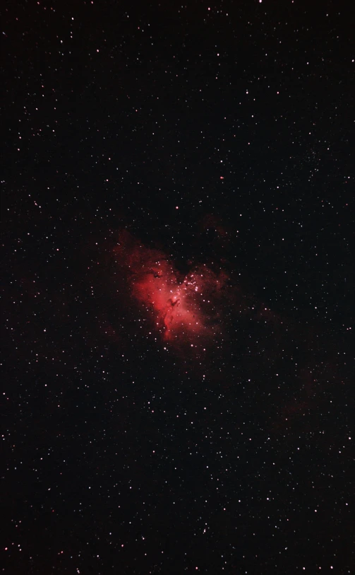 a bright red object with many stars around it