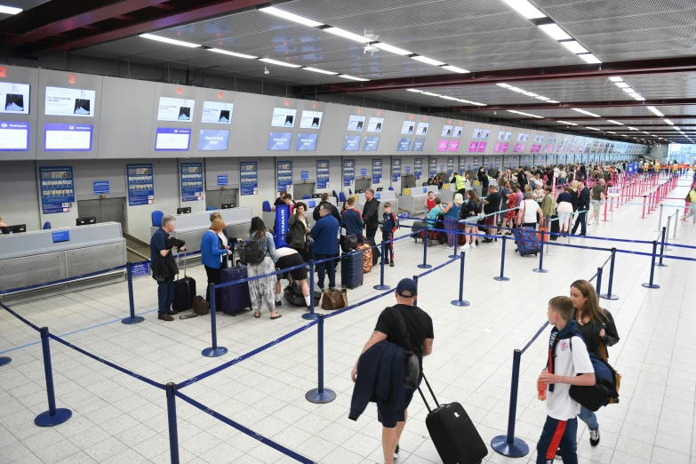 the travelers in the terminal wait for their turn