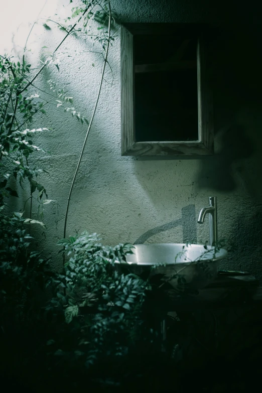 a bathroom with green walls and a mirror