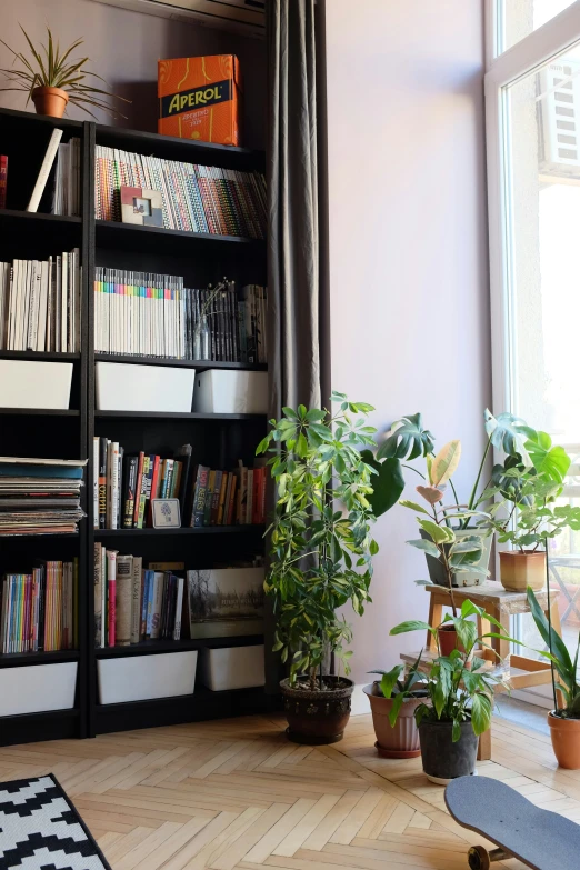 a room with lots of books on bookcases