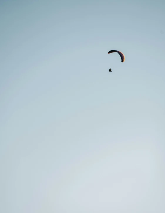 two people are para sailing on a clear day