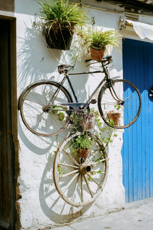 a bicycle mounted to the side of a building