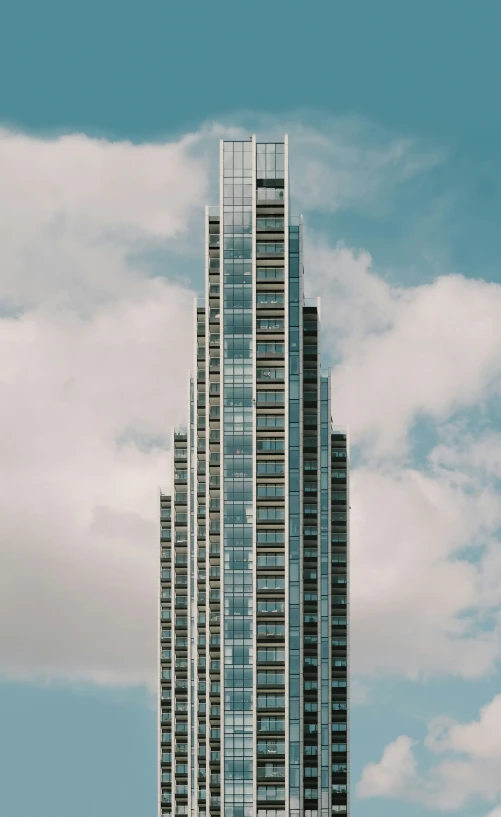 a view from a parking meter looking at a high building