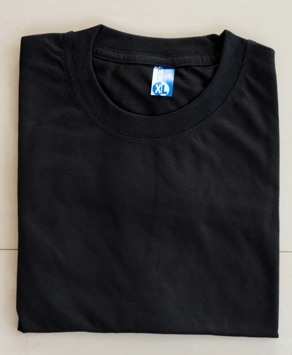 a dark black t - shirt with a small white and blue box logo