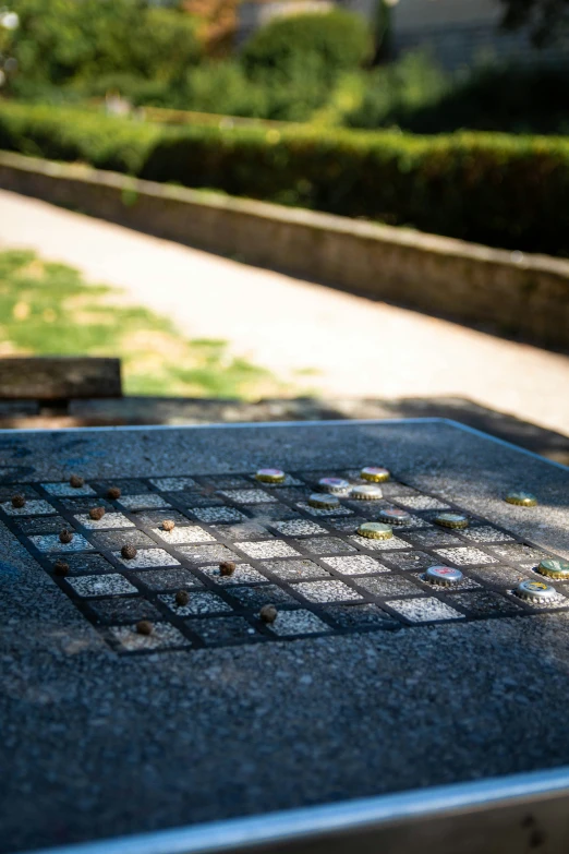 there is a small tiled thing on the sidewalk