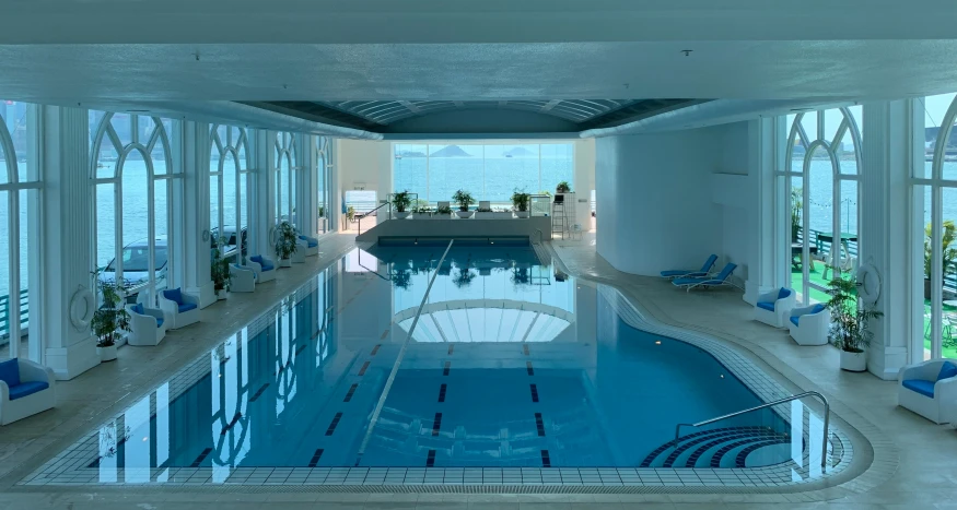 indoor swimming pool in luxury home with clear water