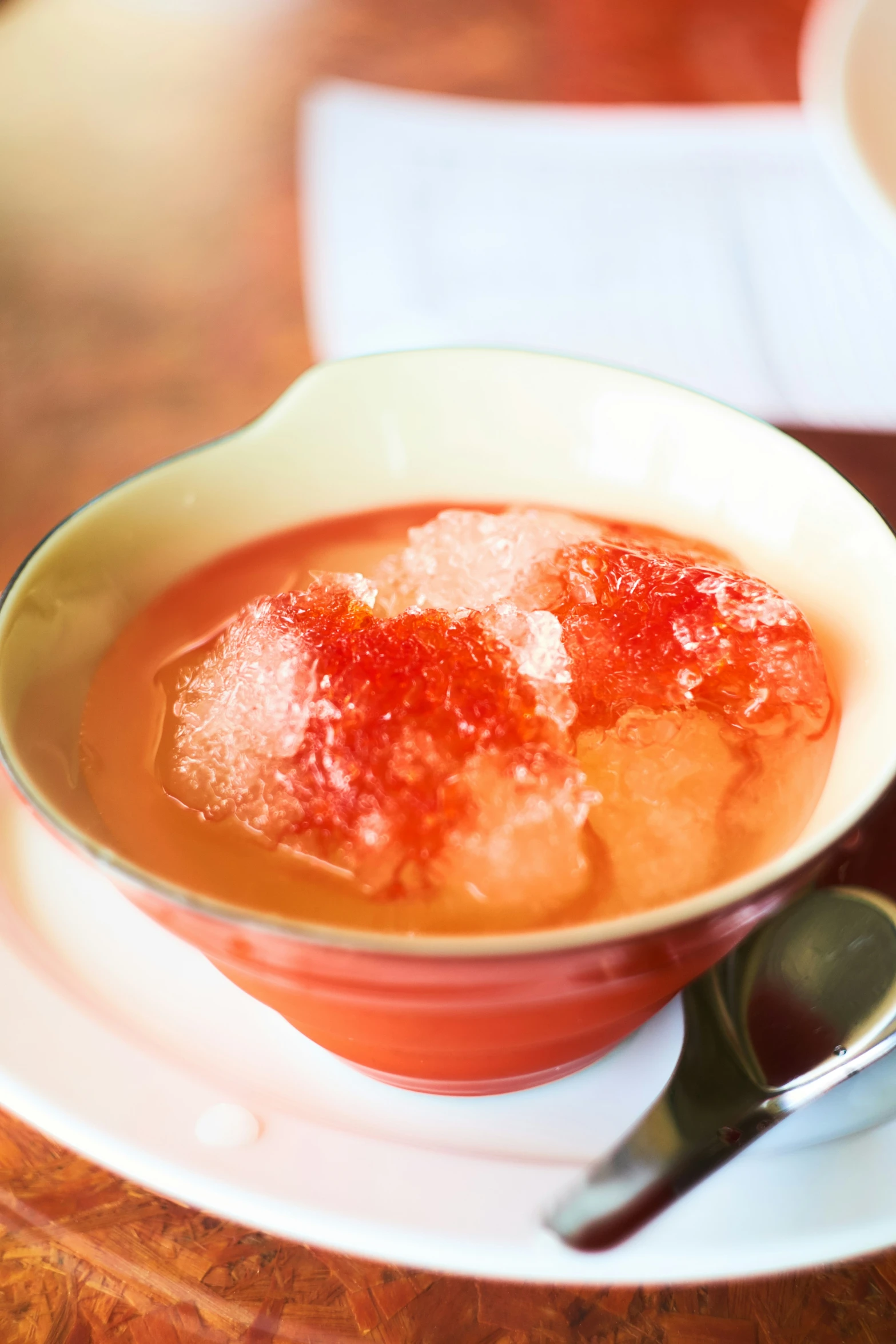 some soup is in a bowl on top of a plate