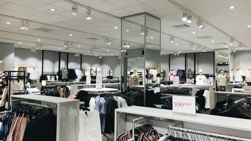 clothing in a store with many different styles and fabrics