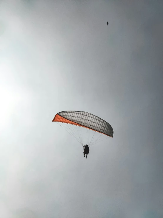 a man is in the air while parachuting