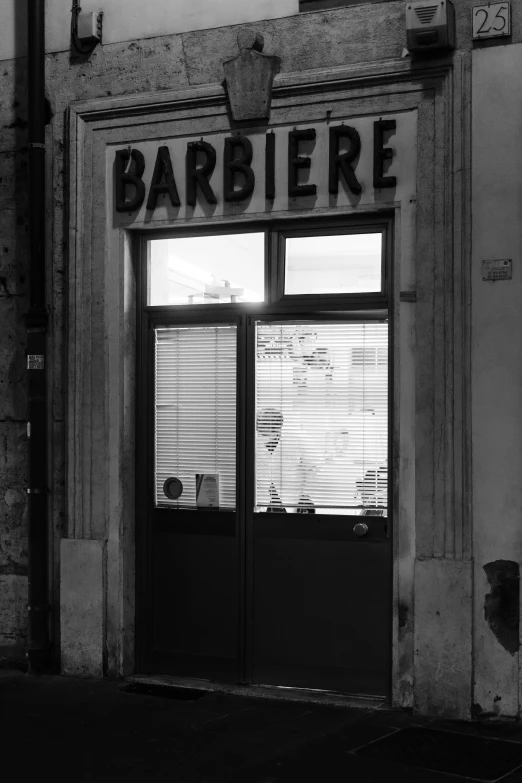 an empty window store with shutters showing outside