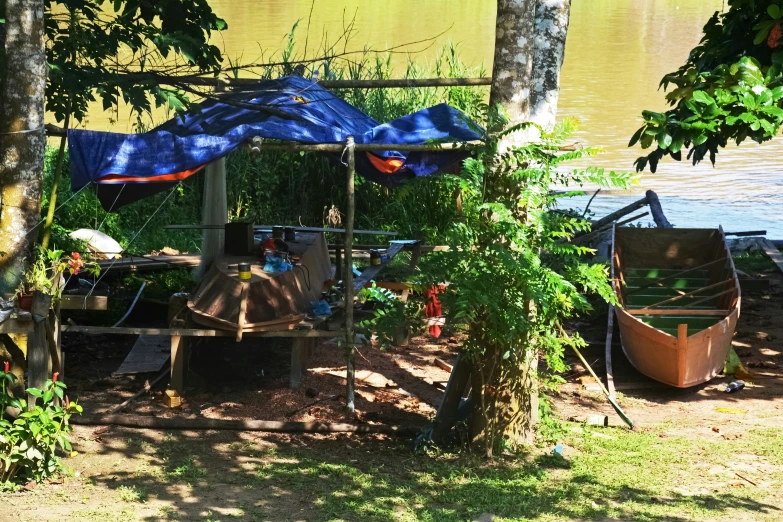 two boats docked on the shore with covers over them