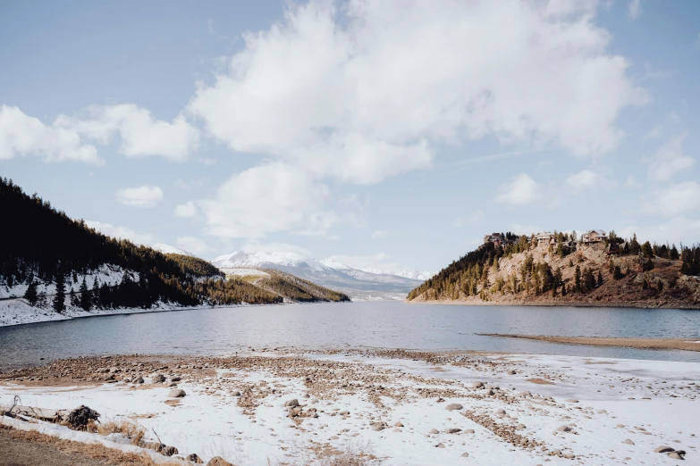 water, land and mountains are covered with snow