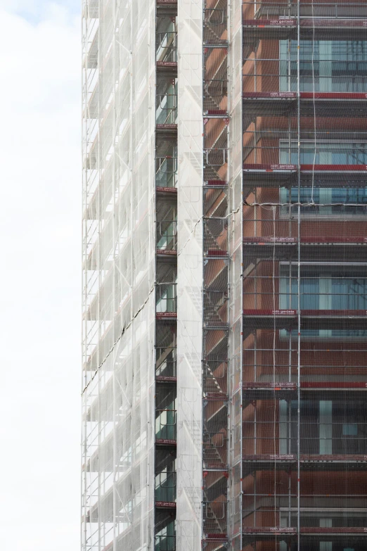 the building has several glass walls on the top