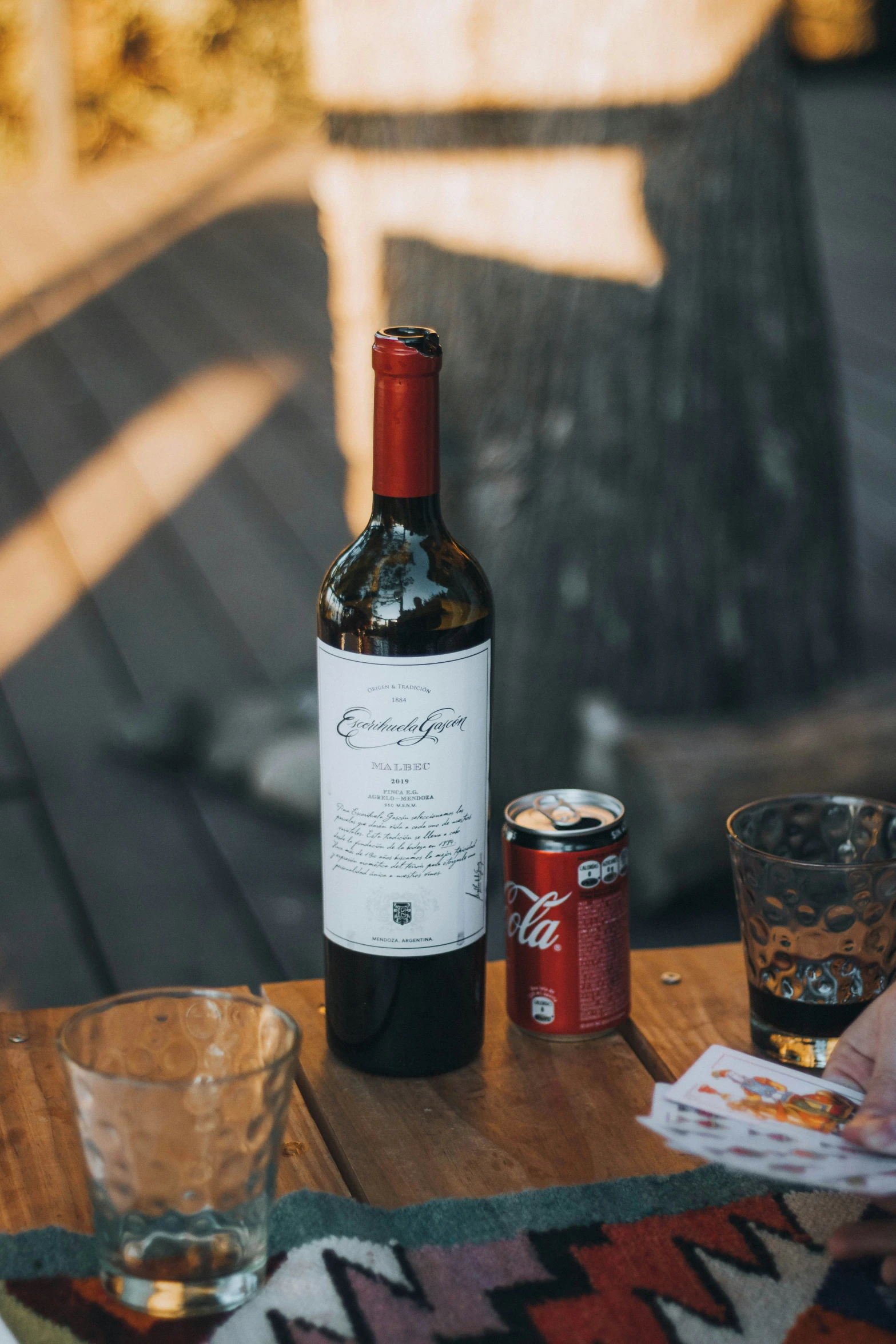 a wine bottle and two s glasses sitting on a table