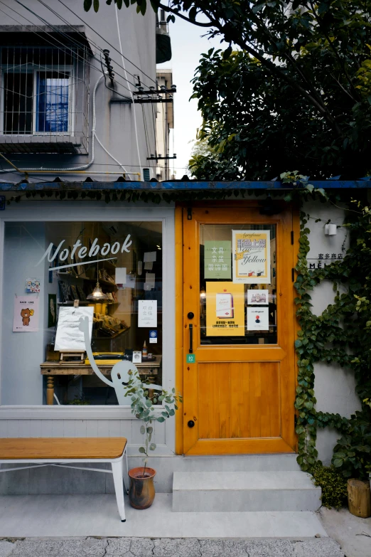 the yellow door to a coffee shop on the street