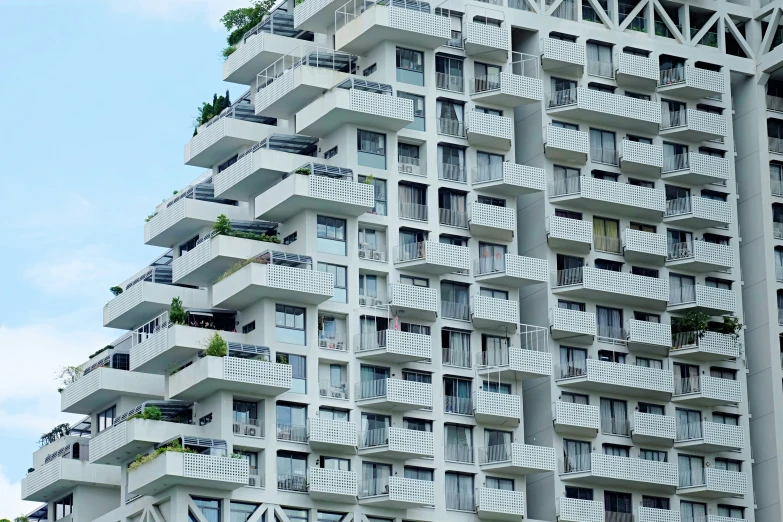 a very tall building with lots of windows and balconies