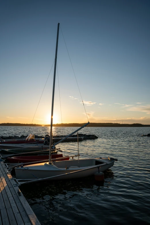 two small boats are docked at the docks