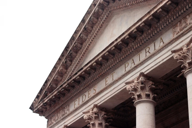 a stone building with columns and carvings