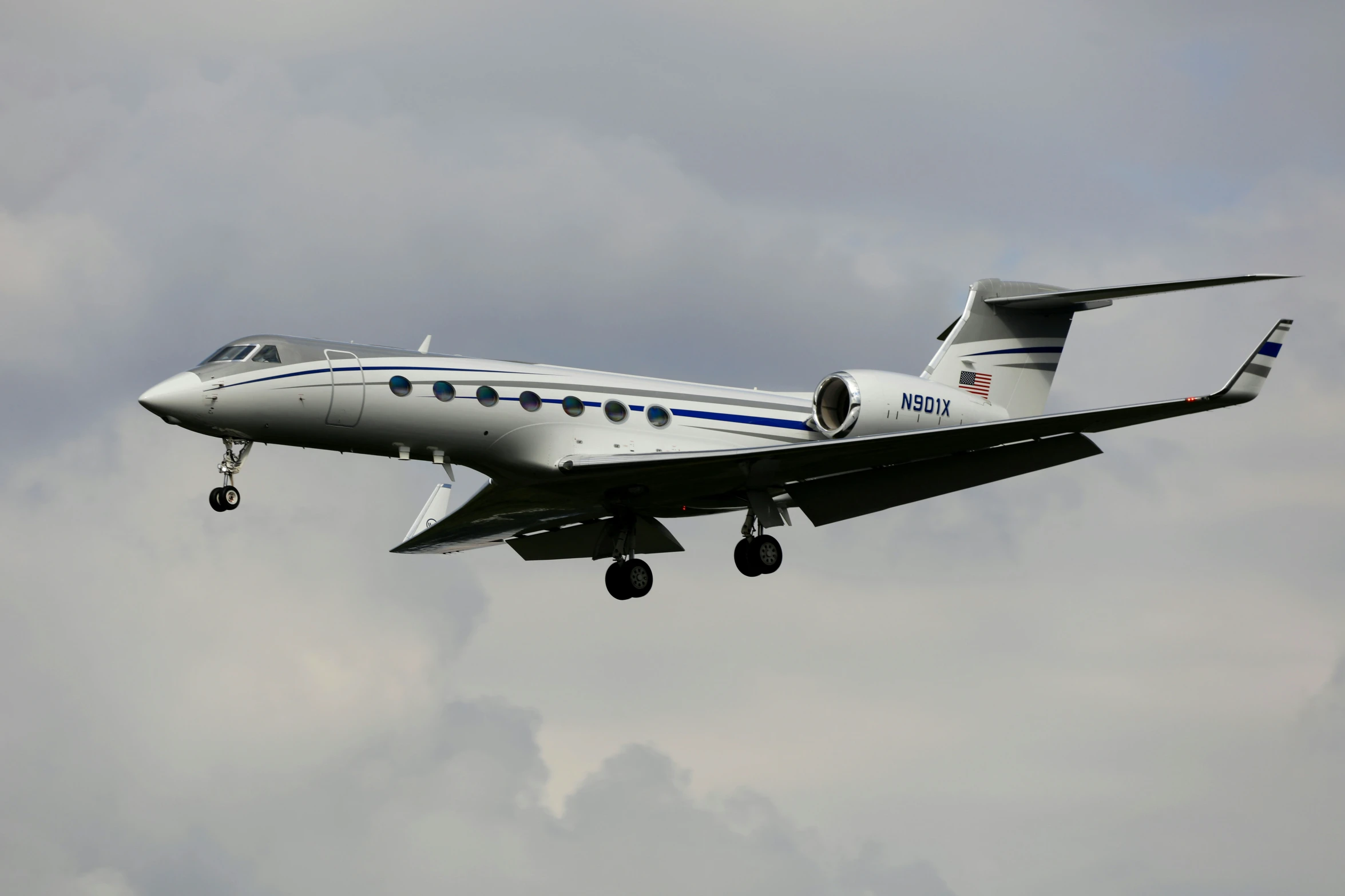 a plane with four propellers flies in the air