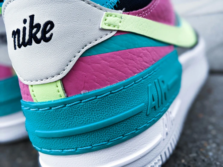 an air force sneakers with colorful leather detailing and colorful laces