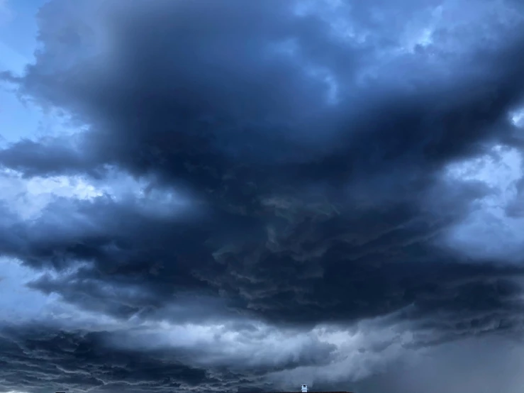 the view of a building under the cloudy sky