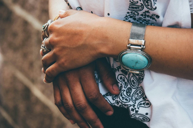 a woman wearing an elaborate watch and celet