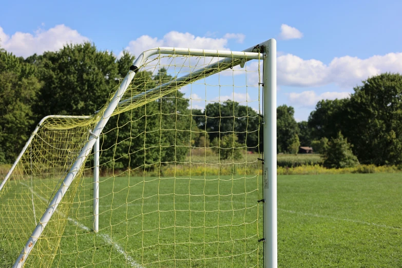 an soccer goal on a green field