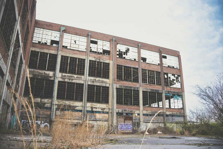 the facade of an abandoned building is shown