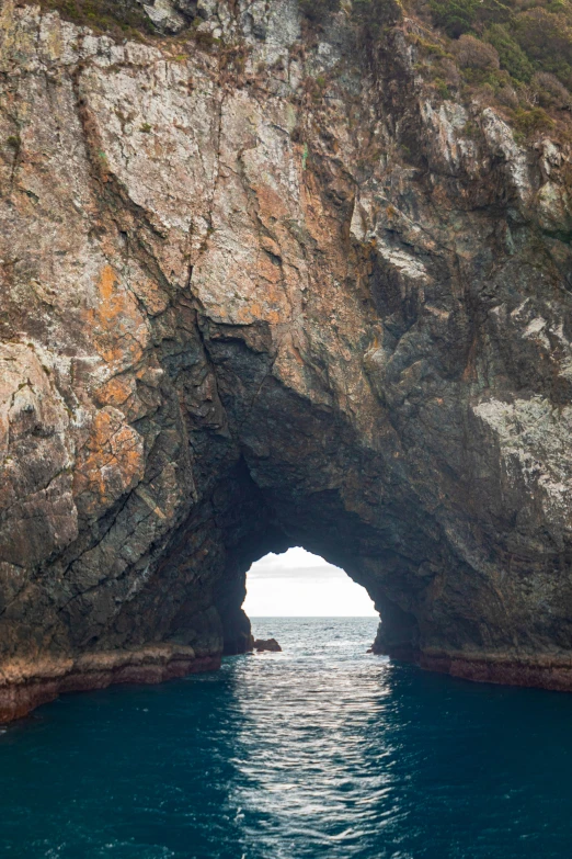 an image of water going under some rocks