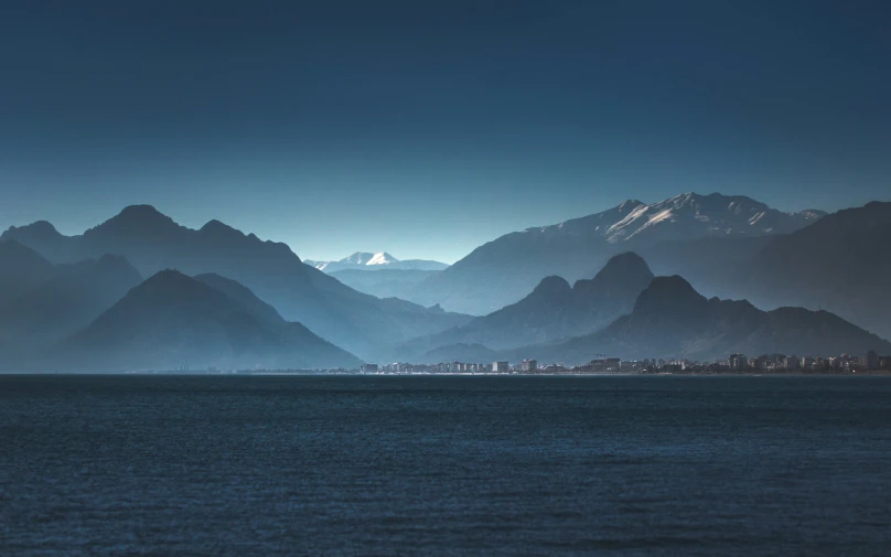 there is an image of some mountains with snow on them