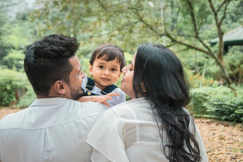 a woman and two men and a little boy