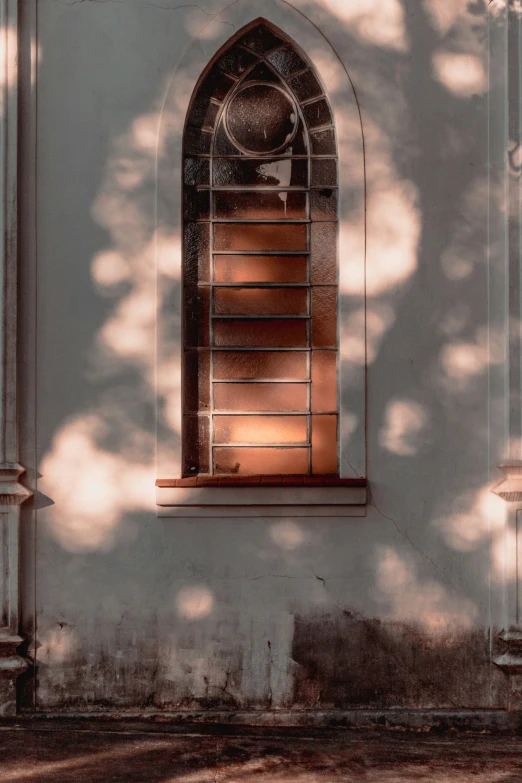 a picture of the shadow of an old church window