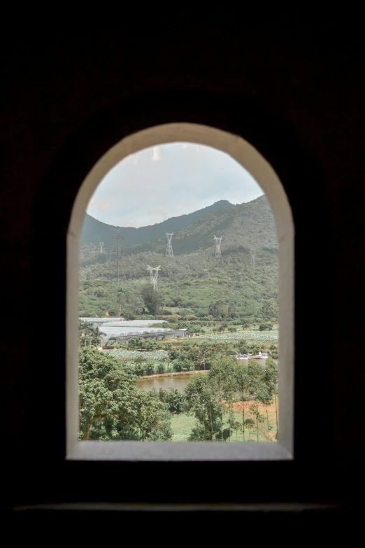 the view out of the open window shows the mountains