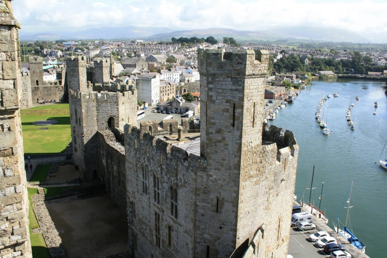 aerial view of some ancient castle ruins along a body of water