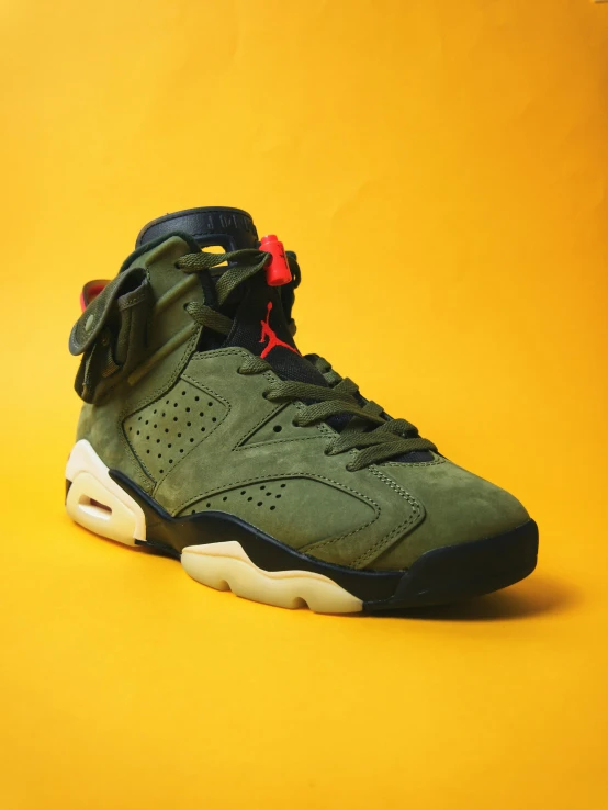 the air jordan 6 is in the color olive green