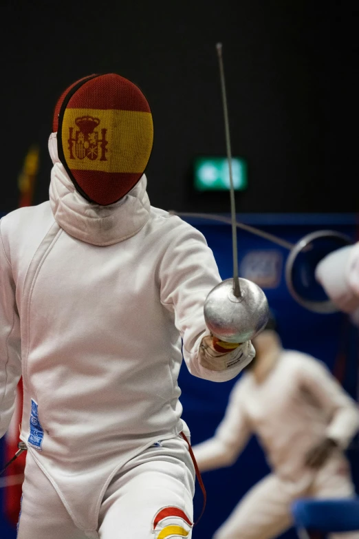 an image of a fencing competition in action