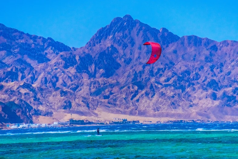 a kite is being flown in the ocean