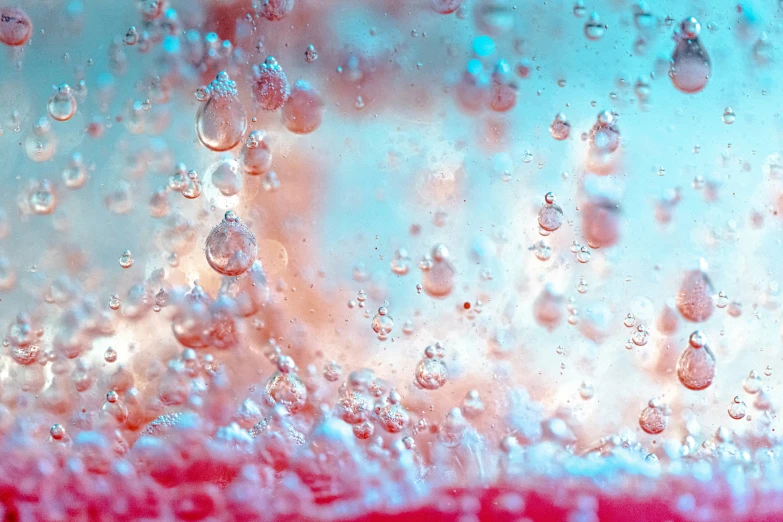 close up of the bubbles of water, red thing to bottom right