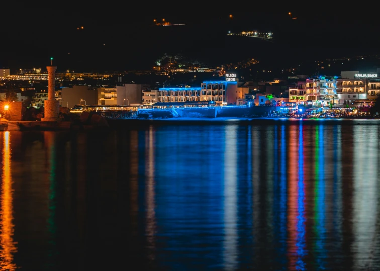 the lights shine brightly in the water at night